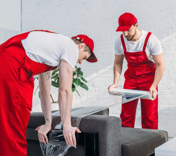 Professional movers handling furniture in Dubai